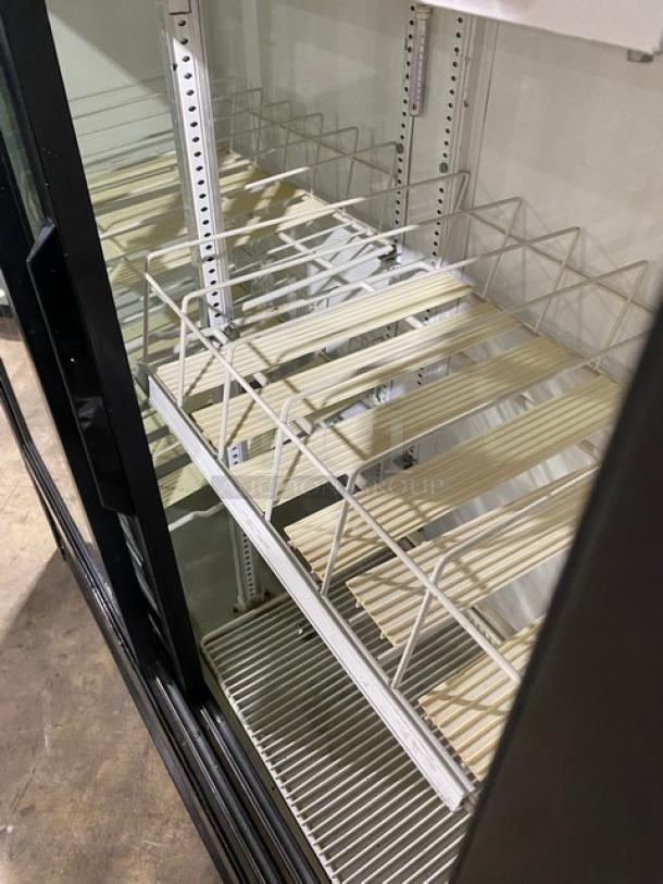 True Commercial Black Double Glass Door Merchandiser Refrigerator, Model GDM-41SL-54, with poly-coated wire racks.