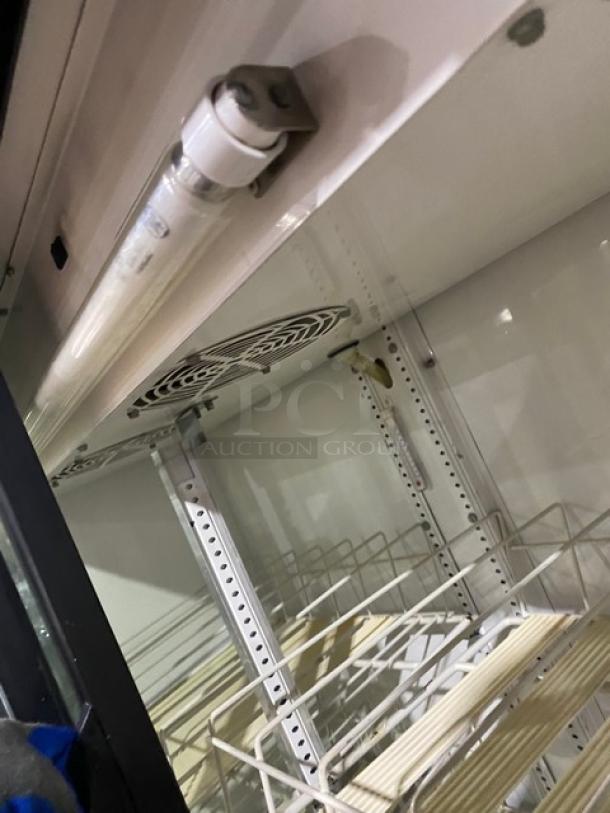 True commercial double glass sliding door refrigerator, model GDM-41SL-54, with poly-coated wire racks, 115V, 1 phase.
