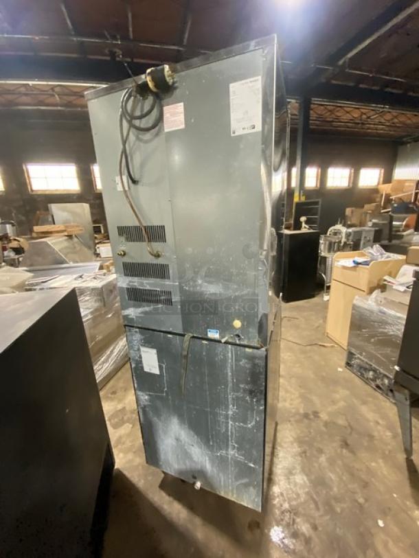 Hoshizaki stainless steel ice making machine and storage bin combo on legs. Features power cords and side panels. Used condition.