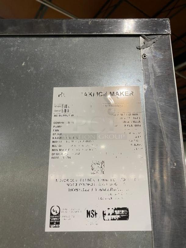 Hoshizaki Commercial Ice Maker and Storage Bin, stainless steel, electric-powered, on legs, model details visible on label.