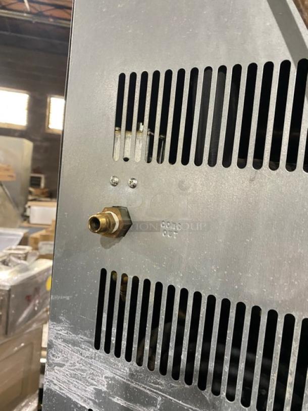 Hoshizaki stainless steel electric ice machine, side view showing ventilation grill and connector. Marking: "COND OUT".