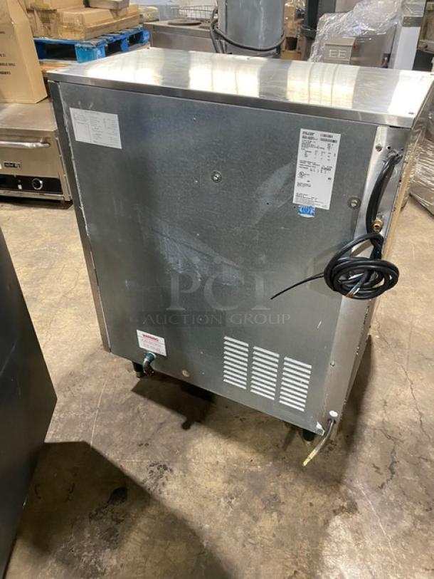 Ice-O-Matic stainless steel flake ice maker, model EF250A32S, electric air-cooled, with sliding top lid, on legs. Serial: 09091280012177.