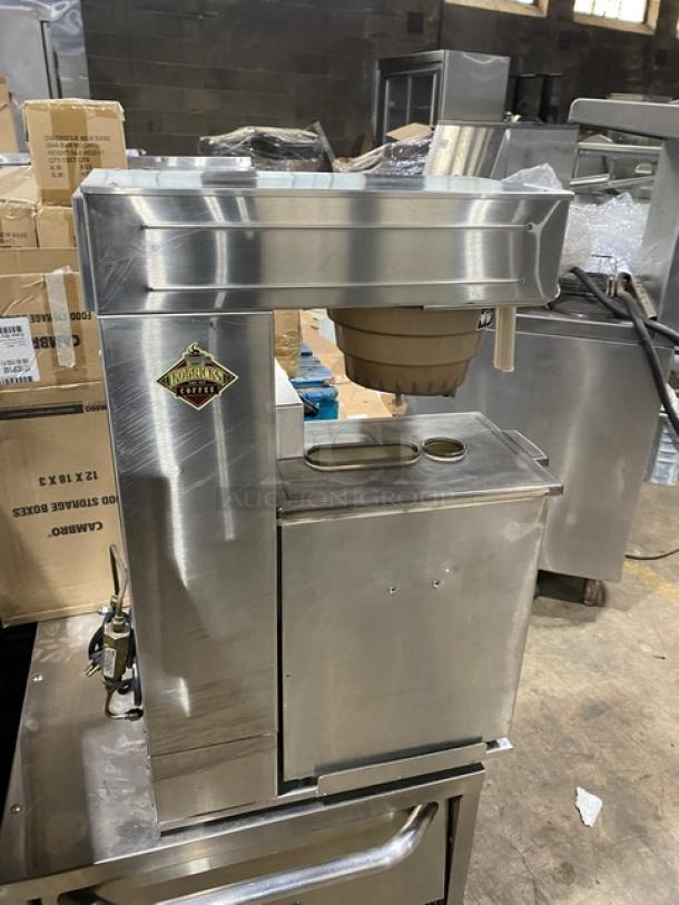 Bunn commercial stainless steel coffee brewer with hot water dispenser, quick brew funnel, and visible coffee label.