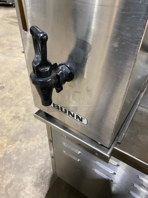 Bunn stainless steel countertop coffee brewer with hot water dispenser and quick brew funnel, in used condition.