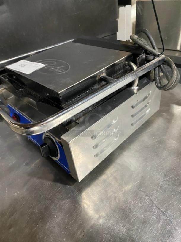 Globe stainless steel electric panini grill with grooved grates, thermostatic control, 120V, on legs, excellent condition.