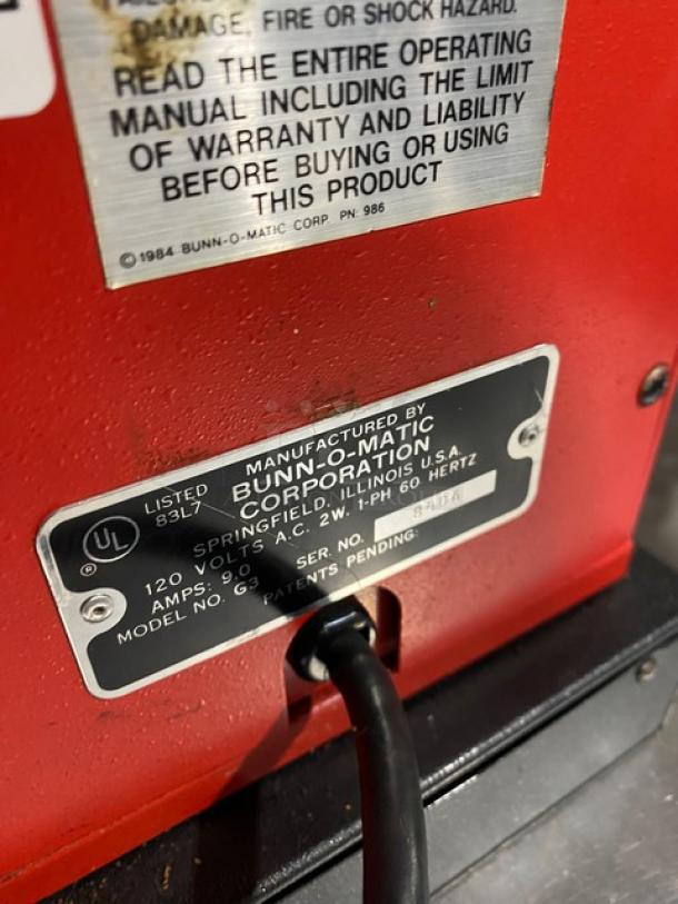 Bunn G3 red commercial coffee grinder, electric, 120V, 1-phase. Model: G3, SN: 8406. UL listed label visible.