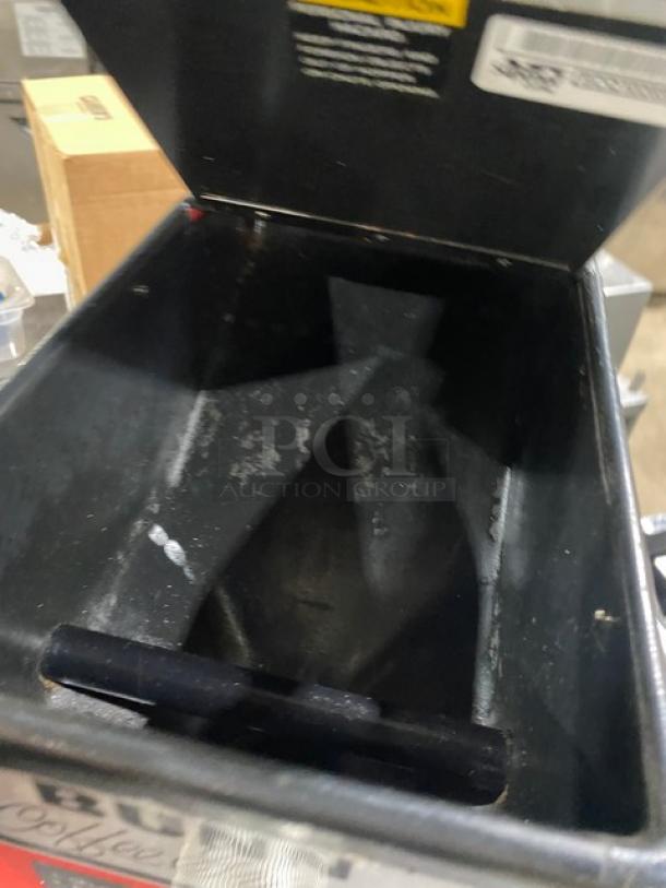 Bunn G3 bulk coffee grinder, red, electric-powered, countertop model. Serial number 8406, 120V 1 Phase. Interior view, fair condition.