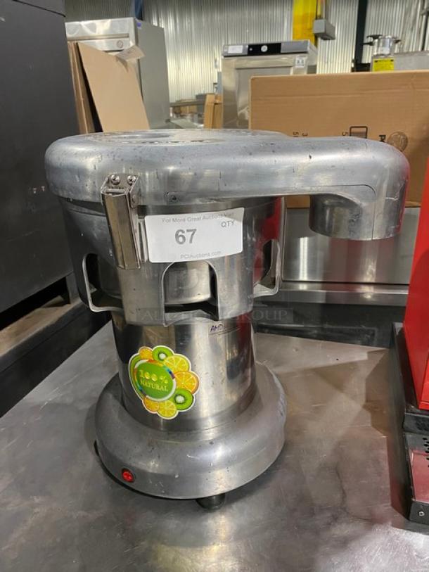 L&J Stainless Steel Juice Extractor, Model WF-A2000, Electric, 110V. Features "100% Natural" sticker, in used condition.