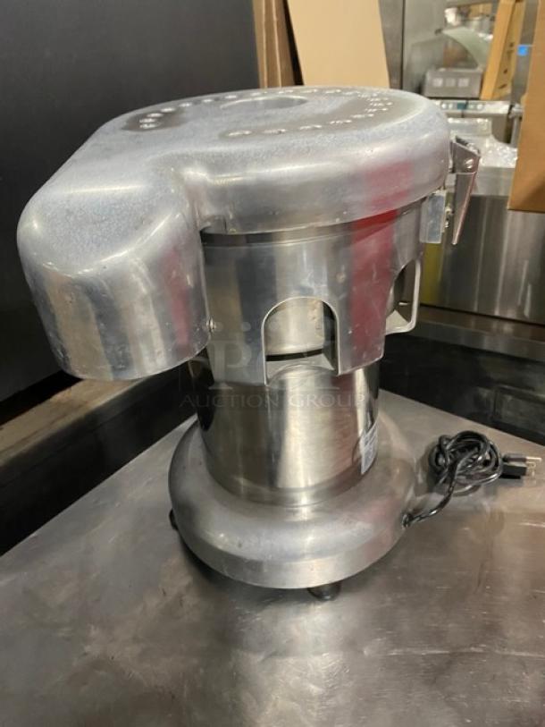 L&J WF-A2000 stainless steel electric juice extractor, excellent condition, 110V, with visible power cord.