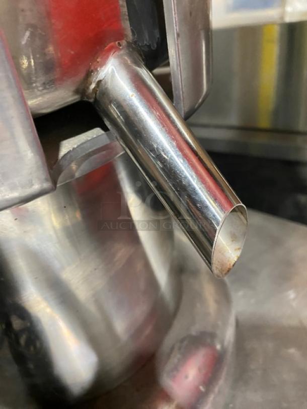 L&J stainless steel juice extractor model WF-A2000, electric powered, featuring a spout detail, 110V, countertop design.