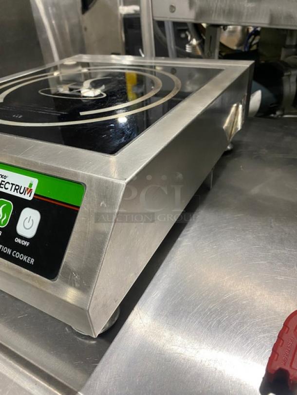 Winco Spectrum Series EICS-18 stainless steel single induction range, electric powered, countertop model, 120V, on legs.