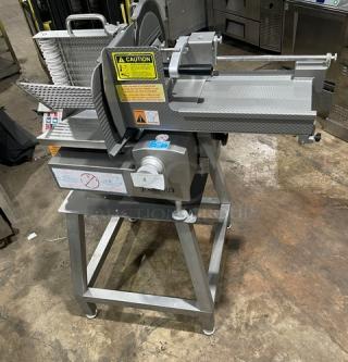 Jaccard VA2000GRT countertop slicer on an open base stand, 110V, with warning labels visible. Commercial kitchen equipment.