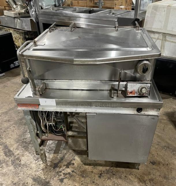 Market Forge Model 1600 stainless steel 16-gal braising pan. Electric-powered, 208V, 3-phase, on legs. Visible wear.