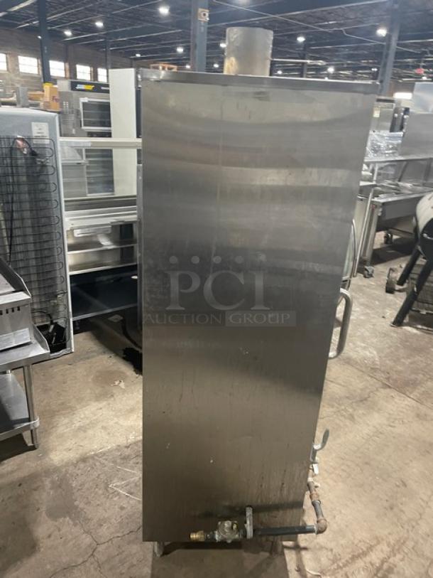 L&J Stainless Steel Natural Gas Smokehouse Oven, Model CWSH-30, Serial SH-5075, Free-standing on legs, visible gas connection.