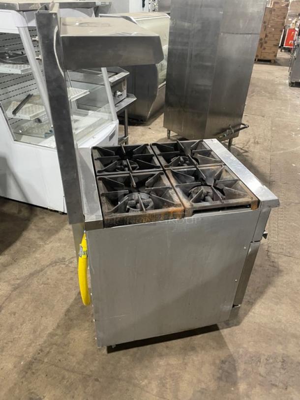 Cookline commercial stainless steel 4-burner gas range/oven combo with backsplash, overhead salamander shelf, and casters.