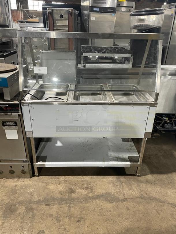 Serv-Ware EST31 stainless steel electric 3-well hot food table with sneeze guard and undershelf, model EST3-1, SN: M1100228, 120V.
