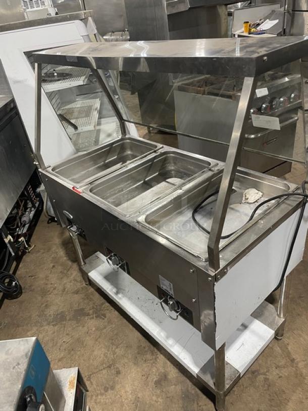 Serv-Ware EST3-1 stainless steel 3-well steam table, electric, with sneeze guard and undershelf. Model: EST3-1, SN: M1100228.