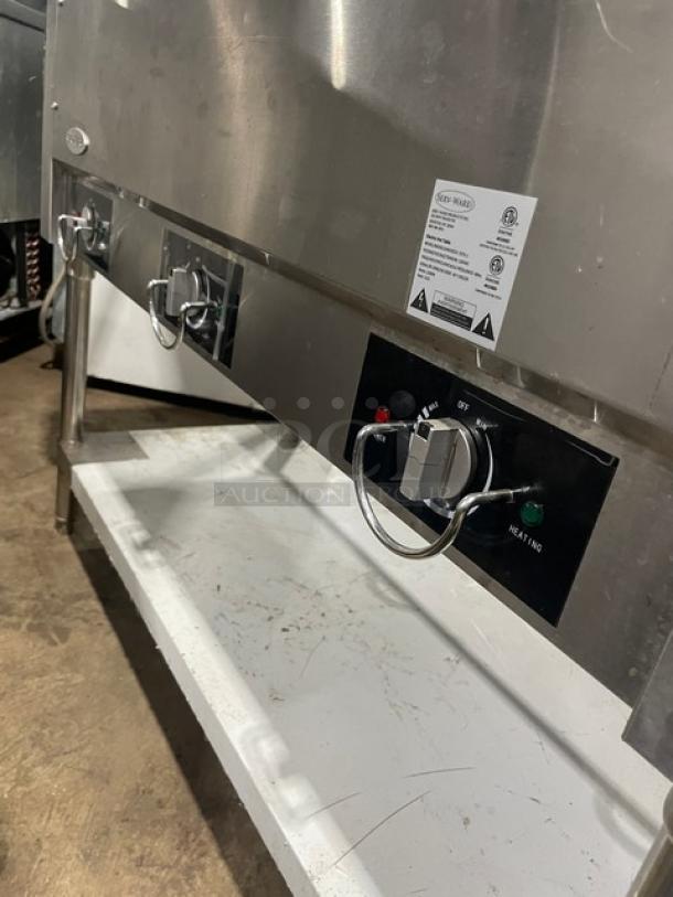 Serv-Ware EST31 stainless steel 3-well hot food table with sneeze guard, single undershelf, and 120V power. Serial M1100228.
