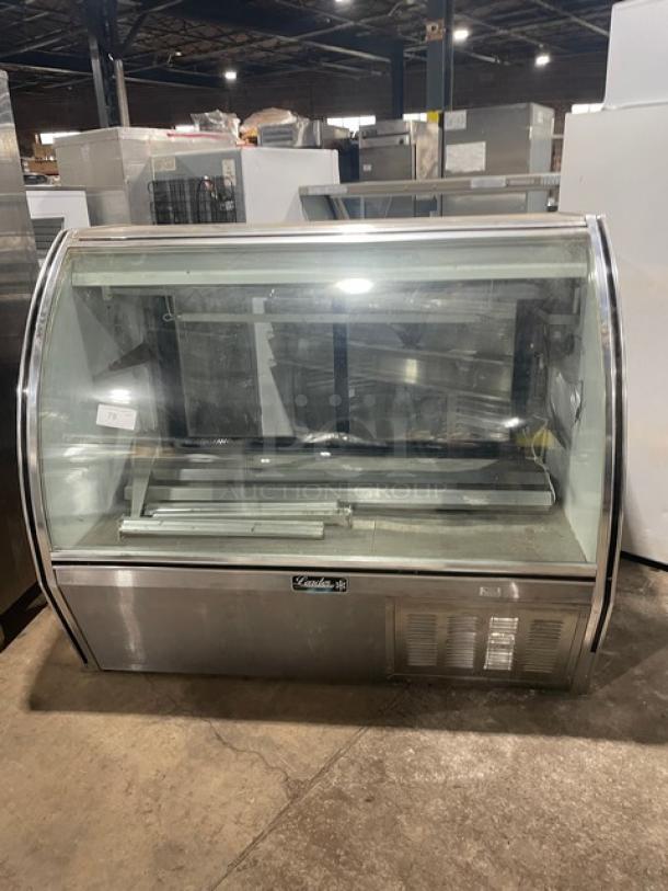 Leader 60" curved glass refrigerated meat deli merchandiser, Model NRHD60SC, with rear sliding doors and storage.
