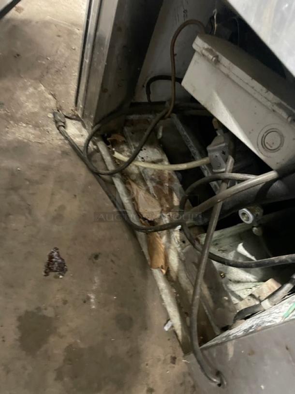 Stainless steel component from Leader NRHD60SC deli display, showing exposed wiring and some wear. Model tag not visible.