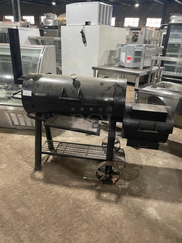 Brinkmann Professional Series black offset smoker/grill, charcoal-powered, with vent controls and storage shelf, used condition.