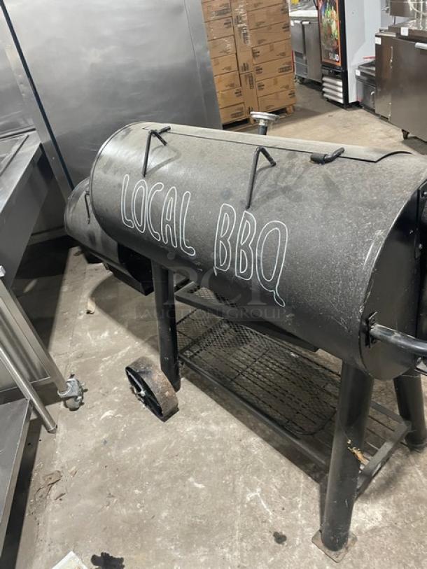 Brinkmann Professional Series black offset smoker/grill with "Local BBQ" text. Charcoal-powered, used condition.