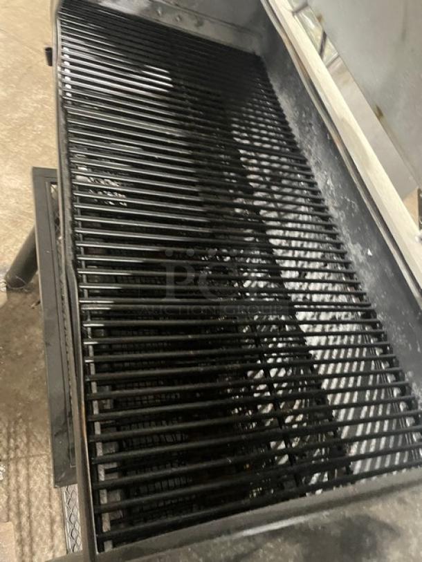 Brinkmann Professional Series black offset charcoal smoker/grill, showing spacious grilling area and sturdy construction.