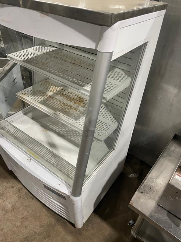 Empura EMPEOM36W refrigerated display case with adjustable shelves, white exterior, visible rust spots, model label.