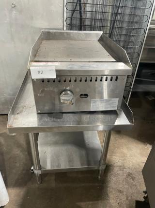 Adcraft ECTG16NG stainless steel gas griddle with splash guards on equipment stand. Includes control knob and label.