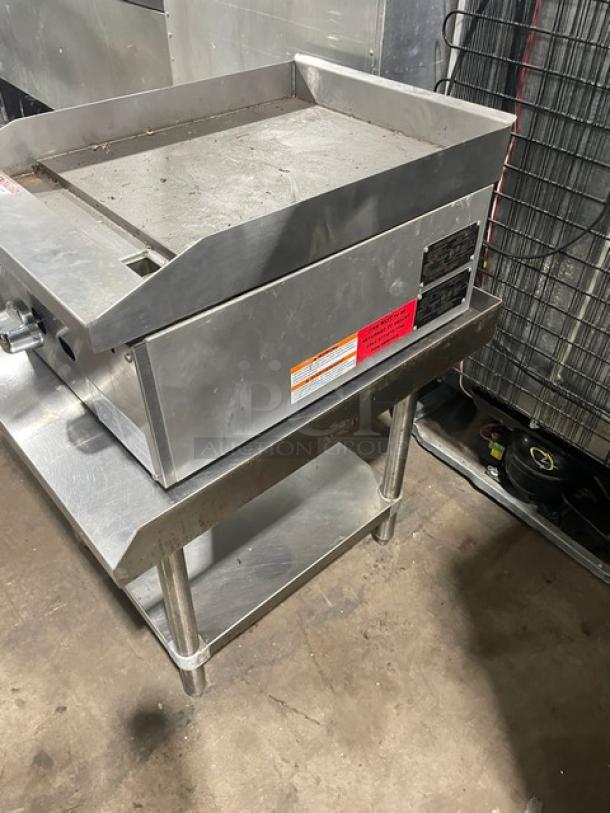 Adcraft ECTG16NG stainless steel countertop flat griddle, natural gas, with back/side splash, on undershelf stand.