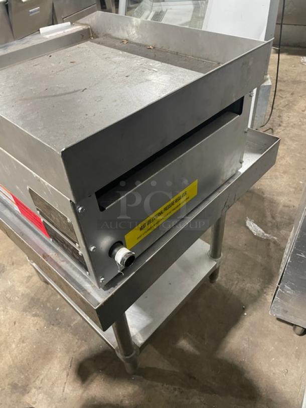 Adcraft ECTG16NG stainless steel natural gas countertop flat griddle with back and side splash, on undershelf stand.