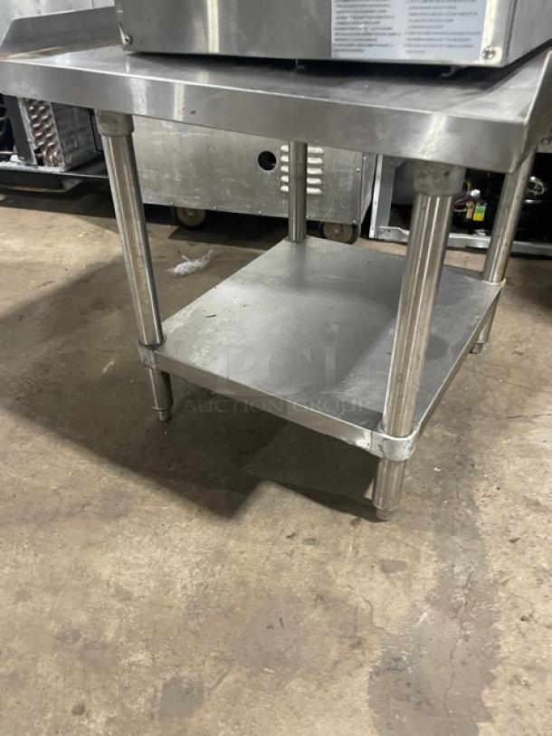 Adcraft stainless steel gas griddle model ECTG16NG with backsplash and undershelf stand. Appears in good condition.