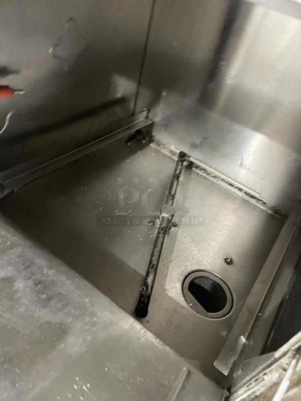CMA Energy-Mizer L1X16 stainless steel undercounter dishwasher interior. Shows spray arm and drain. Model: L1X16, SN: 254632.