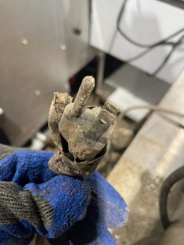 Corroded power plug on CMA Energy-Mizer commercial dishwasher, model L1X16, indicating possible electrical issues.