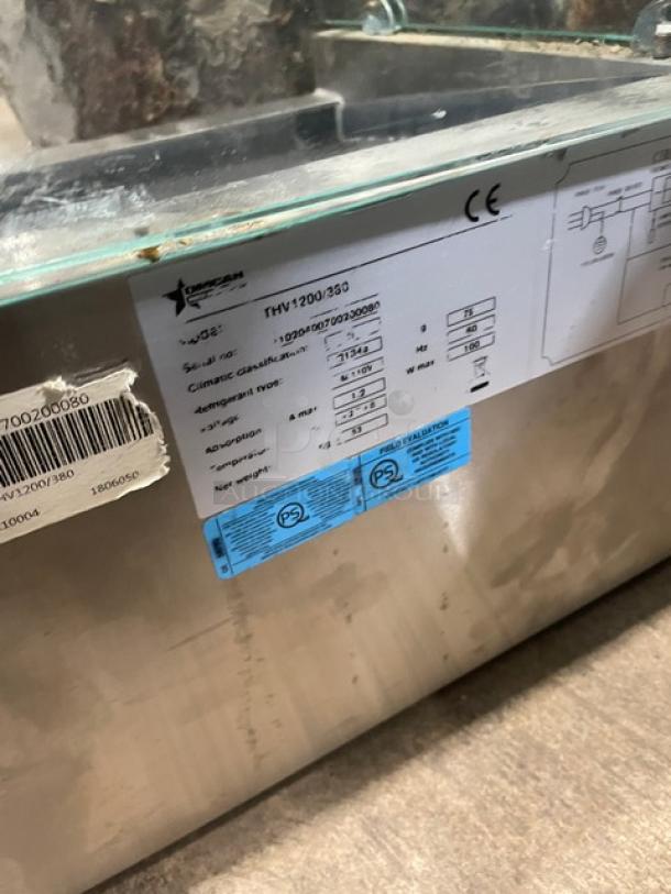 Omcan stainless steel electric refrigerated display case, model THV1200380, serial 0020400700200080, 110V, benchtop use.