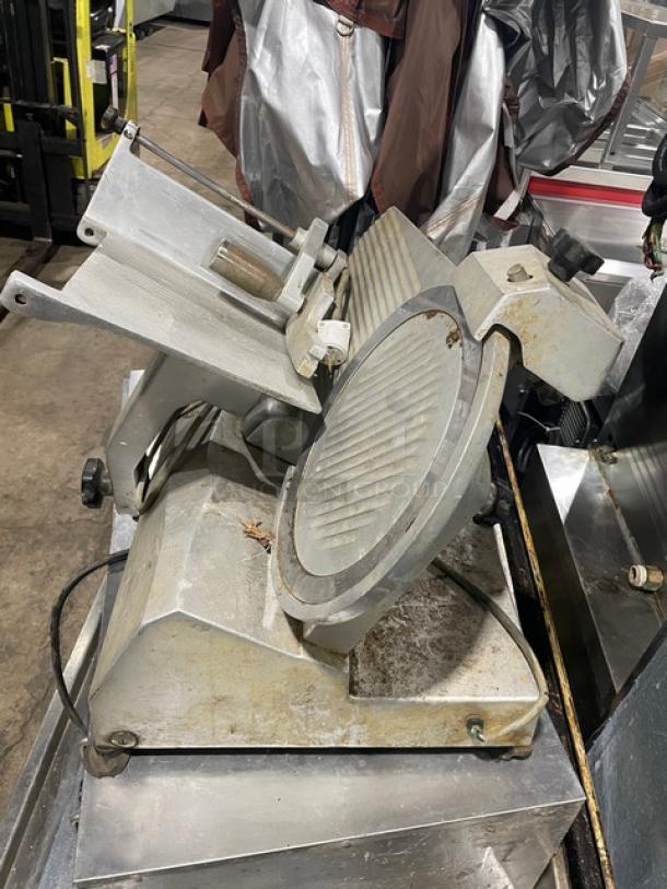 Univex Duro Series electric countertop deli meat slicer in used condition, on legs. Features adjustable blade.