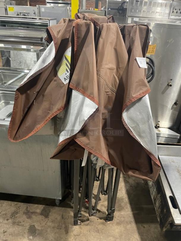 ABCCanopy Commercial brown foldable pop-up canopy tent, partially open, features metal frame. Good condition.