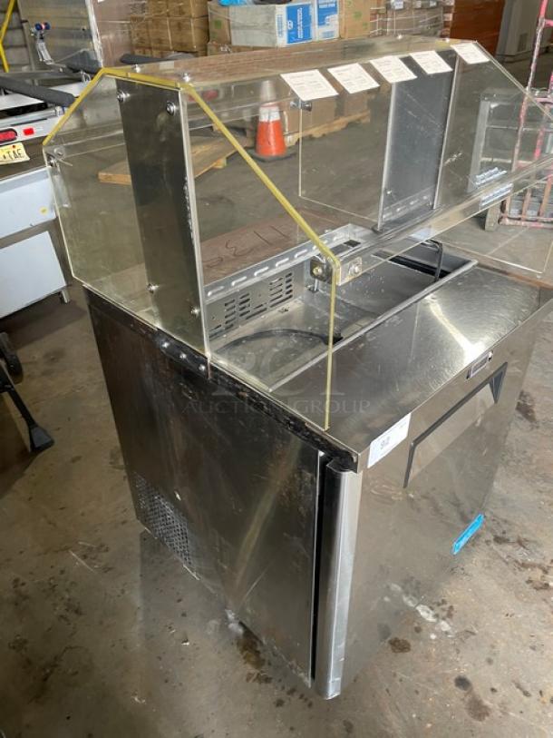 Turbo Air M3 Series stainless steel single door refrigerated prep table, model MST-28-711S, with sneeze guard and poly-coated wire rack.