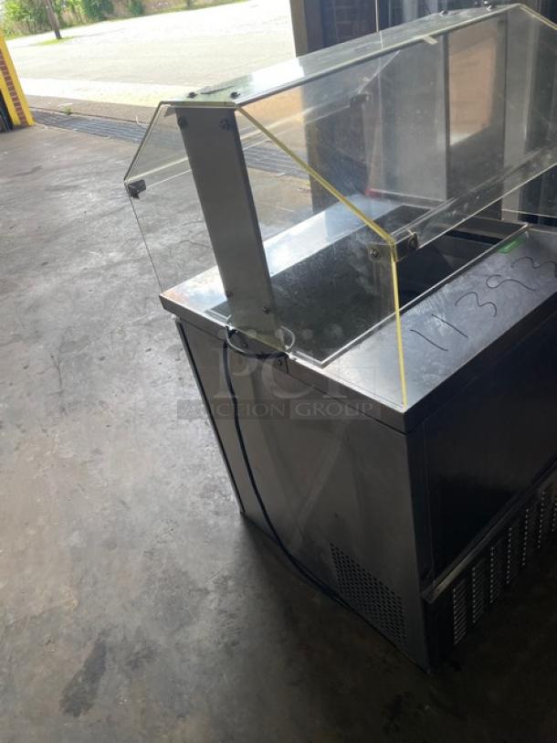 Turbo Air MST28711S stainless steel single door refrigerated prep table with sneeze guard, poly-coated wire rack, 115V.