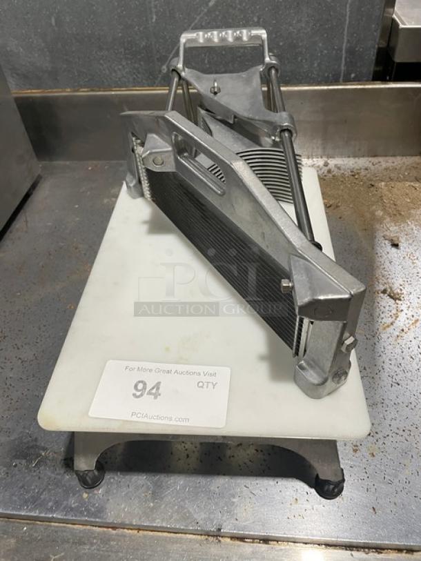 Commercial heavy-duty countertop tomato/vegetable slicer with easy slice cutting board, on legs. Shows slight wear. Item tag reads "94."