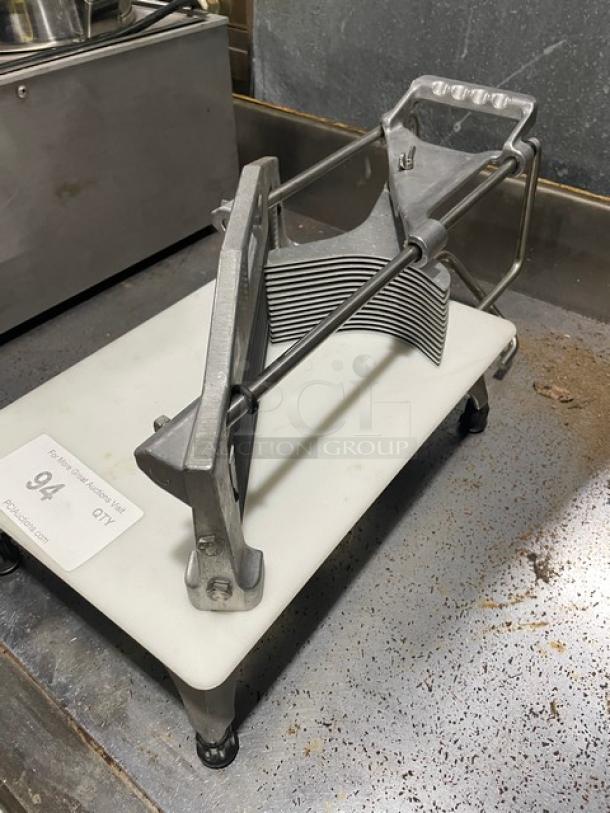 Commercial heavy-duty countertop vegetable slicer with easy slice cutting board and legs. Metal construction, used condition.