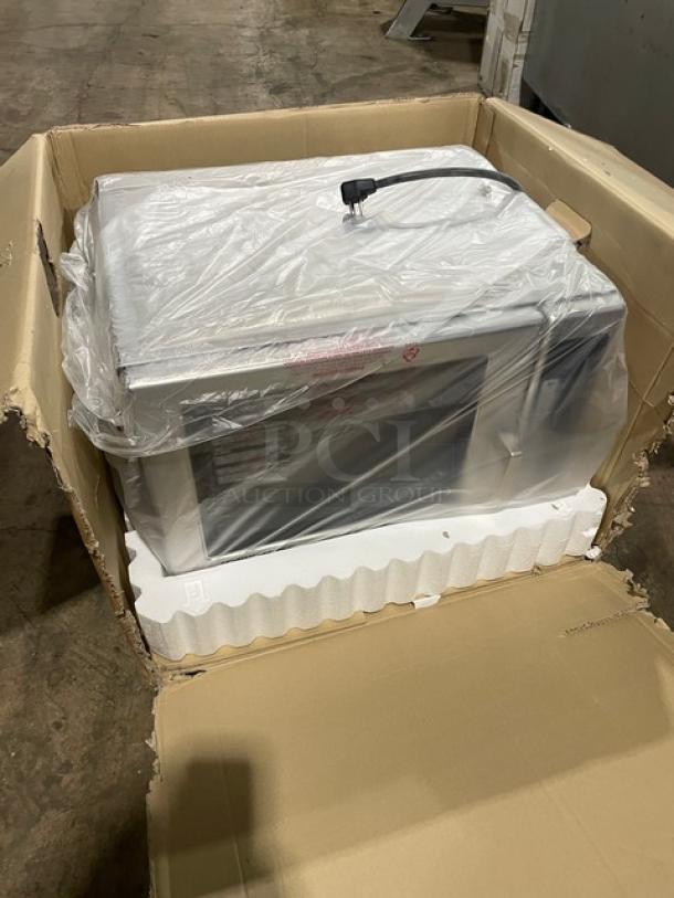 NEW Menumaster RFS12TSW commercial stainless steel microwave oven in box. Features digital push button controls. 120V.