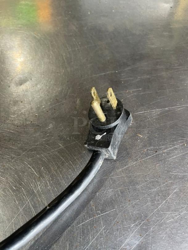Close-up of a power plug for the Beverage-Air Model WTF27A freezer. Standard two-prong plug.