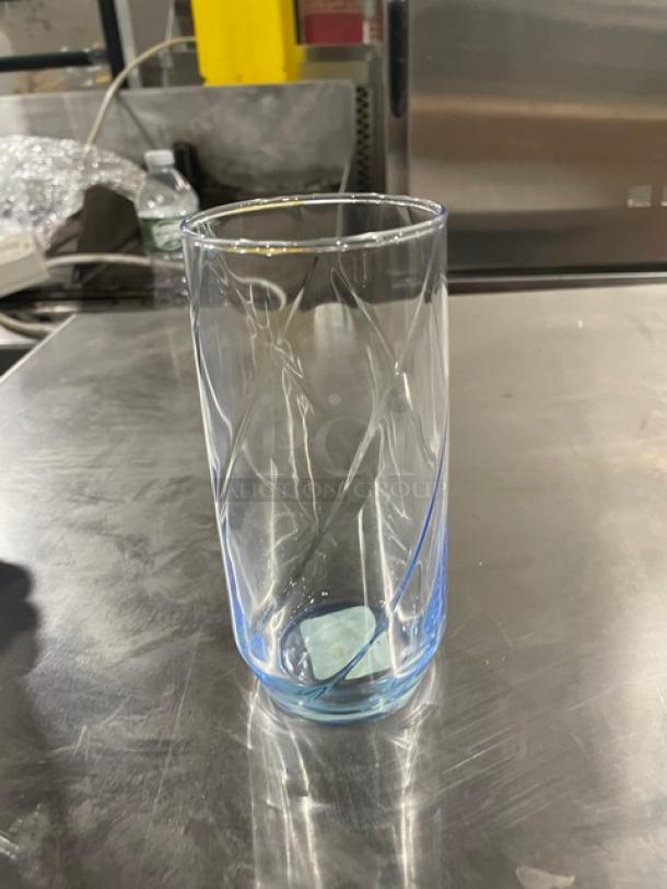 Libbey 17 oz iced tea glass, clear with blue tint, model 46504M, new condition, swirl pattern, holds 3 dozen per case.