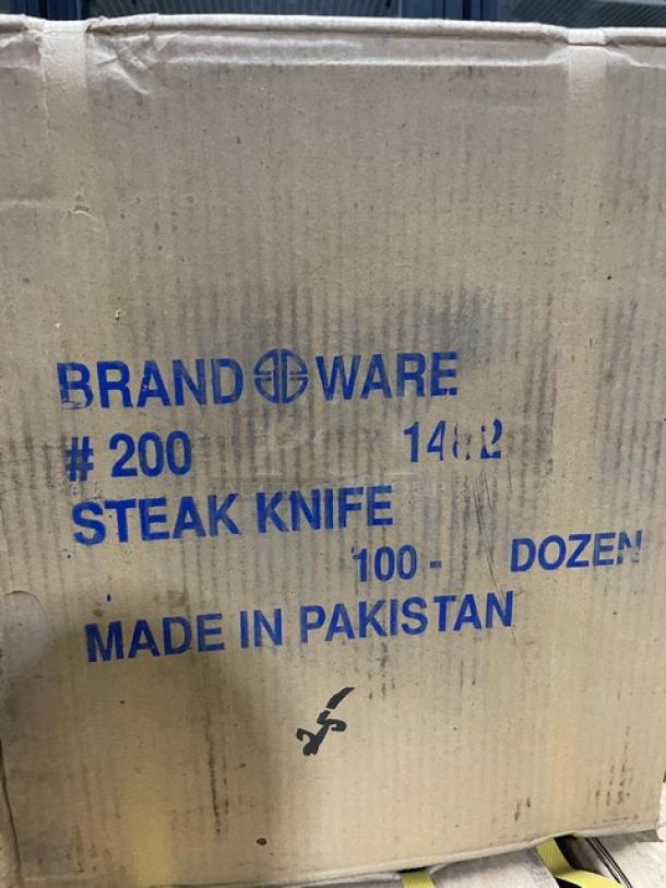New pallet of Brand Ware 8" steak knives, model 2001482, 100-dozen per case, stainless steel with wooden handle, made in Pakistan.