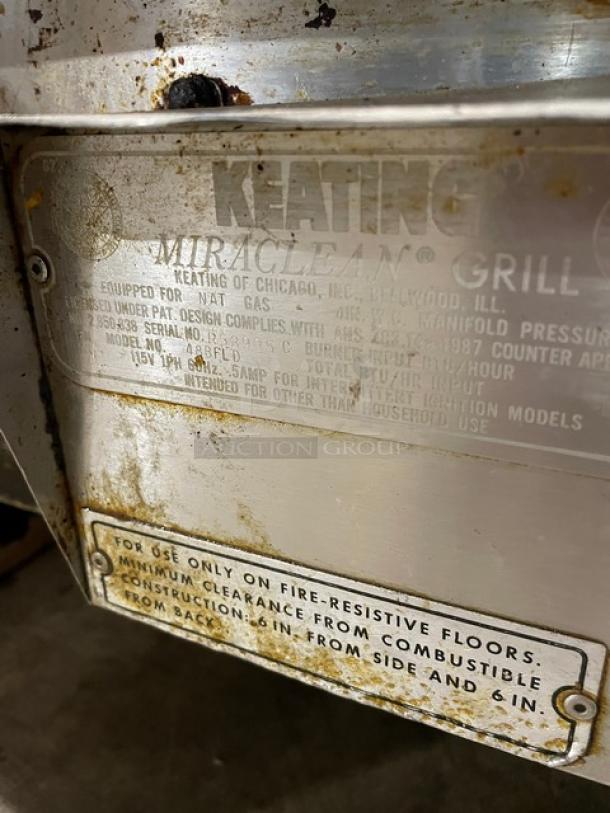 Keating Miraclean Griddle, Model 48BFLD. Stainless steel, natural gas powered, with back and side splash. Serial: R53995C.