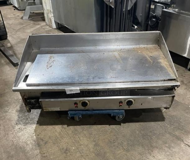 Keating 48BFLD stainless steel natural gas griddle, chrome finish, with back and side splash, on legs, model 48BFLD.