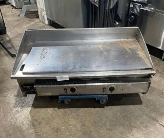 Keating 48BFLD stainless steel natural gas griddle, chrome finish, with back and side splash, on legs, model 48BFLD.