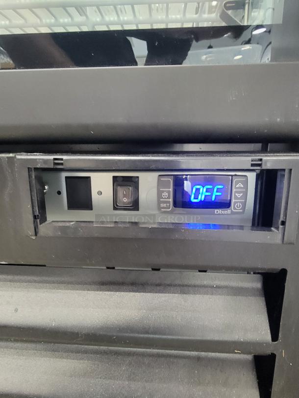 Digital control panel of Supera PEGD-2DR-48-ES-SI-HC merchandiser, featuring a power switch and temperature settings display.