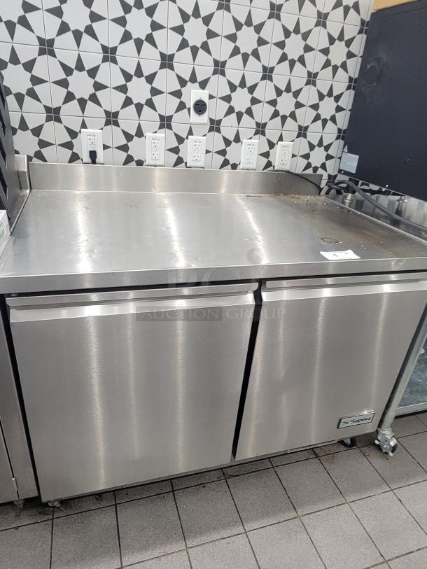 Supera PWTR48-SI 4' refrigerated work top counter with casters, stainless steel, dual doors, good condition.